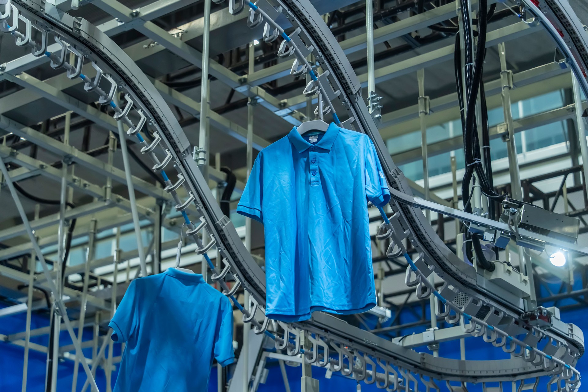 clothes are being conveyed to automatic machine clothes are being conveyed to automatic machine